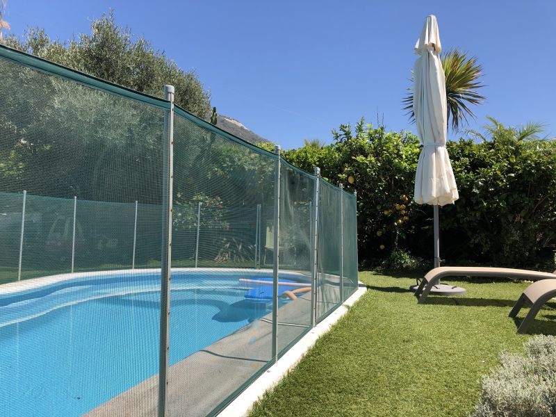 Pool with Mesh Safety Barrier